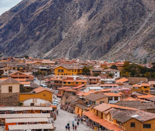 Panoramic view of the historical town Ollantaytambo nestled in the Andes mountains, Cusco, Peru.