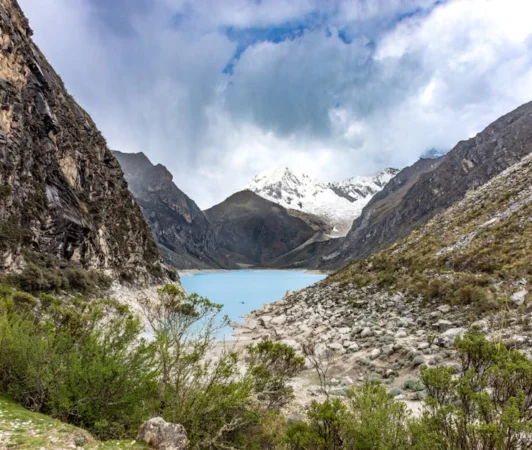 Breathtaking landscape of Llanganuco Lake surrounded by Andean mountains in Huaraz, Peru.
